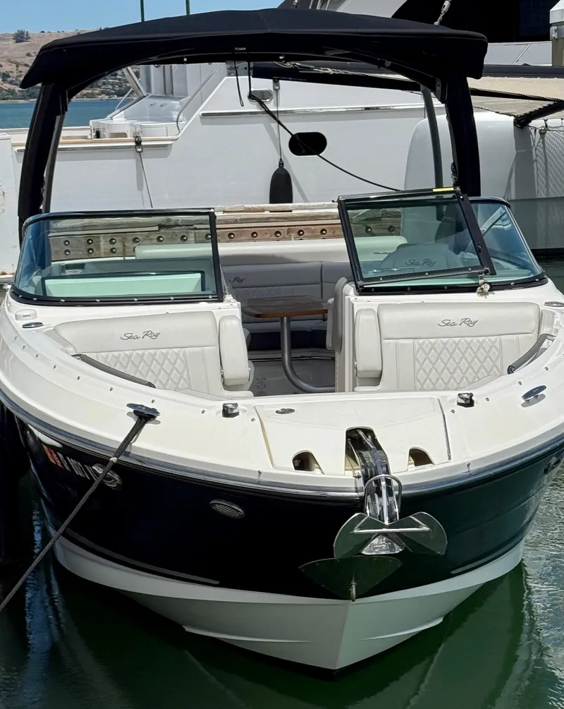 Slide: The Image of 2020 Sea Ray SLX 280 boat docked, featuring sleek design and spacious seating. - 16