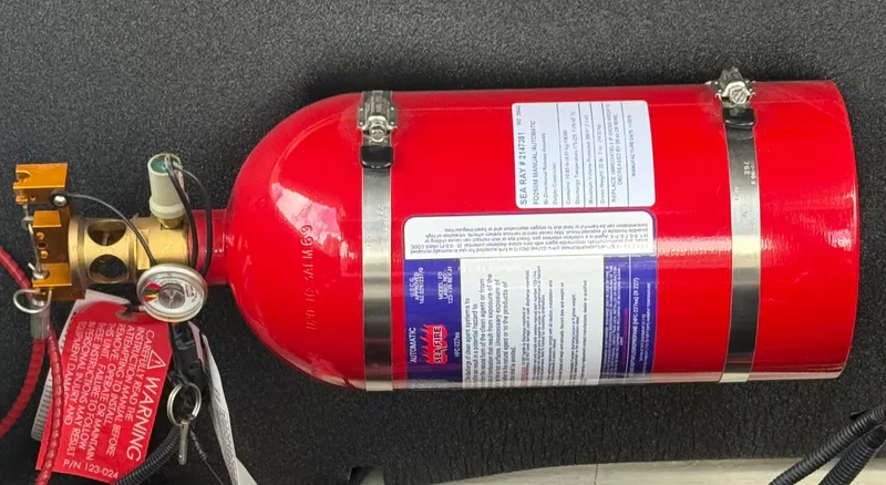 Slide: The Image of Red fire extinguisher mounted on a 2020 Sea Ray SLX 280 boat. - 30