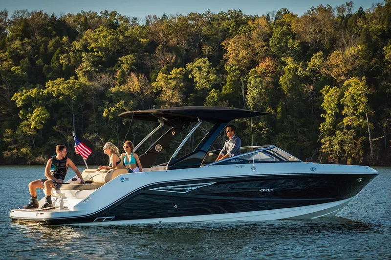 Slide: The Image of Manufacturer Provided Image: 2020 Sea Ray SLX 280 boat cruising on a lake with passengers. - 7