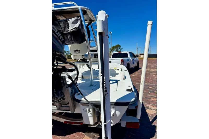 Slide: The Image of 2009 Ranger Banshee boat with Mercury engine on brick pavement. - 28