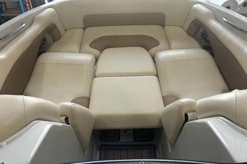 Slide: The Image of 2017 Crownline Eclipse E4 boat interior with beige and brown cushioned seating. - 10