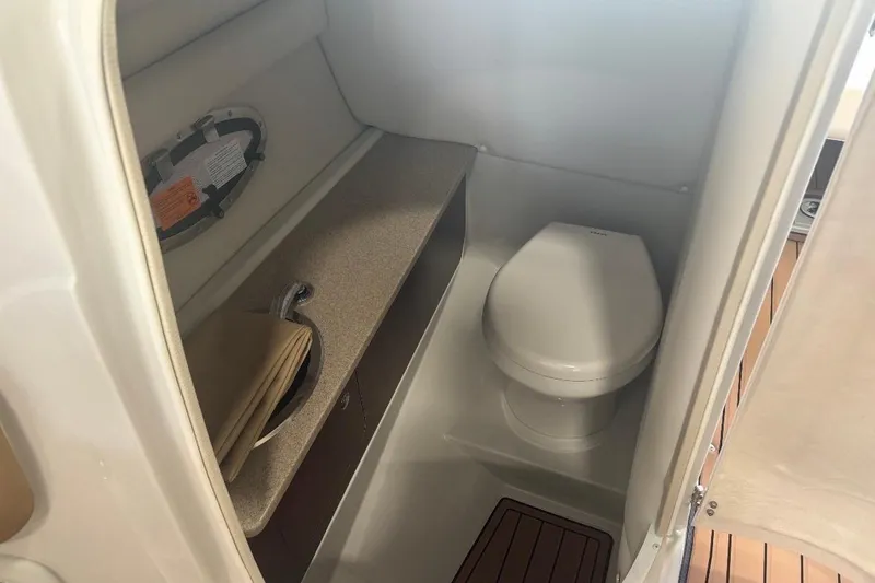 Slide: The Image of 2017 Crownline Eclipse E4 boat interior bathroom with toilet and sink. - 11