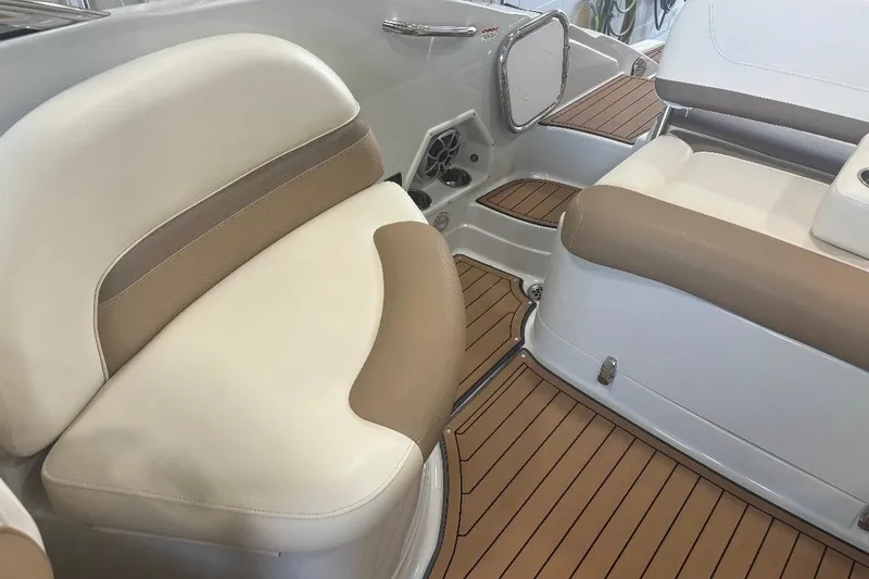 Slide: The Image of 2017 Crownline Eclipse E4 boat interior with beige seating and wood-style flooring. - 12
