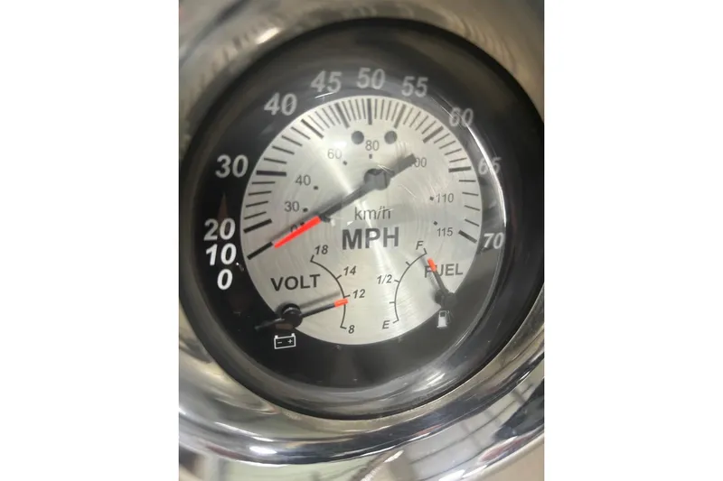 Slide: The Image of Speedometer and gauges of a 2017 Crownline Eclipse E4 boat, displaying speed, voltage, and fuel levels. - 22