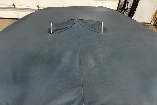 Slide: The Image of 2017 Crownline Eclipse E4 boat with protective cover in a garage setting. - 25