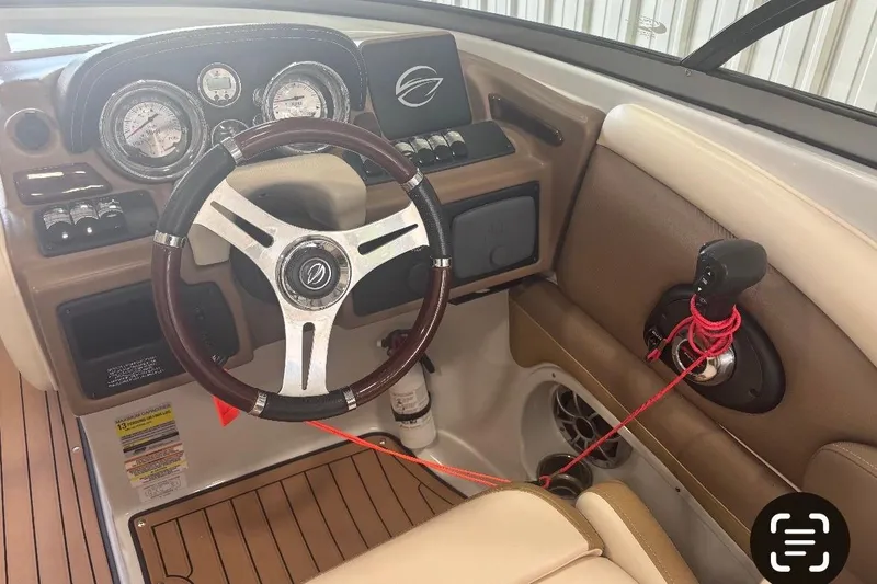 Slide: The Image of 2017 Crownline Eclipse E4 boat dashboard with steering wheel and control panel. - 7