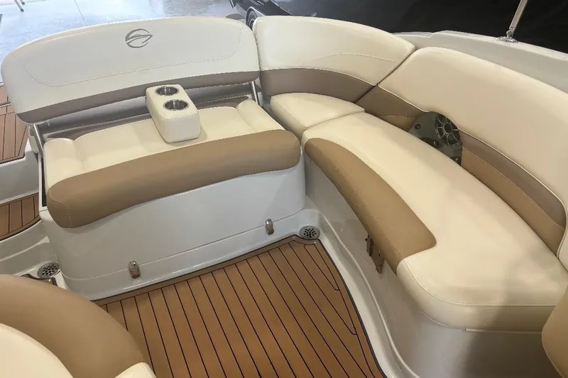 Slide: The Image of 2017 Crownline Eclipse E4 boat interior with beige seating and cup holders. - 9