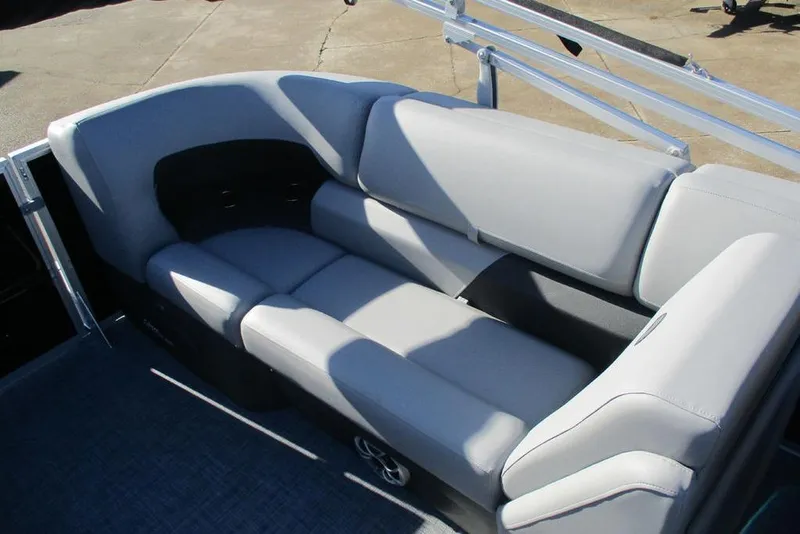 Slide: The Image of 2026 Sun Tracker Party Barge 22 DLX interior seating with gray upholstery. - 12