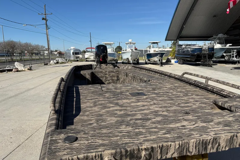 Slide: The Image of 2024 Havoc River Rat 1756 boat in a marina, showcasing its rugged design. - 4