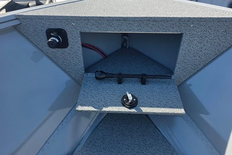 Slide: The Image of 2026 Smoker Craft Freedom 160 TL boat interior with storage compartment and wiring. - 11