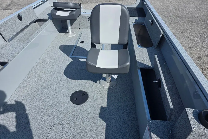 Slide: The Image of 2026 Smoker Craft Freedom 160 TL boat interior with seating and storage compartments. - 14
