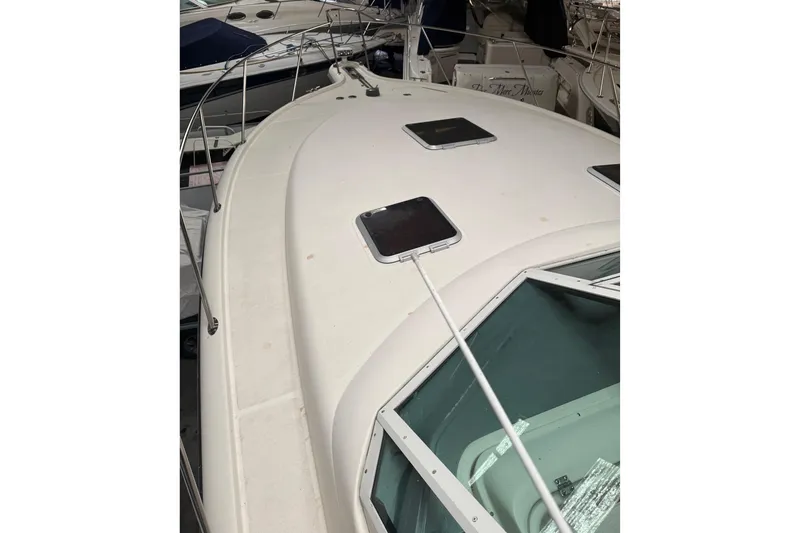 Slide: The Image of 1998 Tiara Yachts 3500 Open boat deck with hatches and railing. - 11