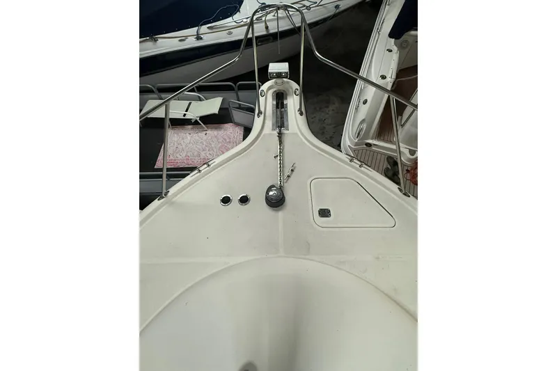 Slide: The Image of 1998 Tiara Yachts 3500 Open boat deck with anchor chain and railing. - 12