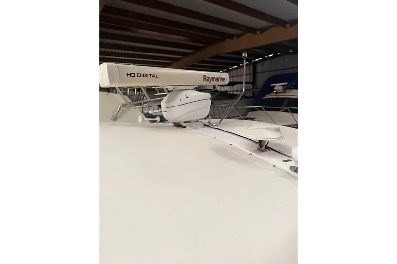 Slide: The Image of 1998 Tiara Yachts 3500 Open with Raymarine HD Digital radar in storage. - 13
