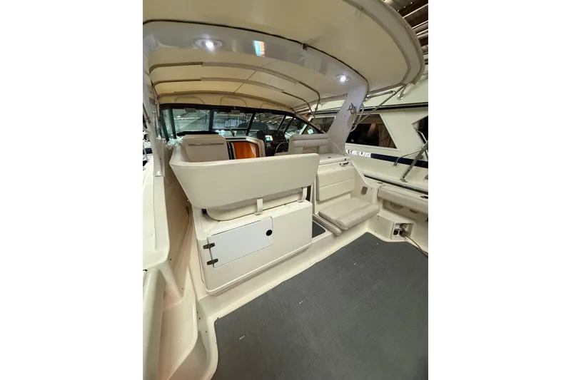Slide: The Image of 1998 Tiara Yachts 3500 Open interior with seating and storage, showcasing elegant design. - 16