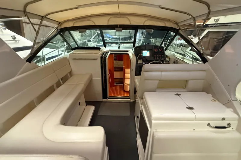 Slide: The Image of 1998 Tiara Yachts 3500 Open interior with seating and helm, showcasing luxury design. - 20