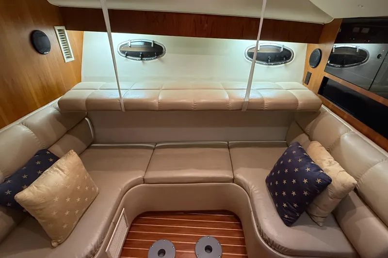 Slide: The Image of Luxurious interior of 1998 Tiara Yachts 3500 Open with plush seating and decorative pillows. - 31