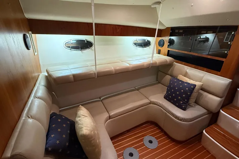 Slide: The Image of Luxurious interior of 1998 Tiara Yachts 3500 Open with plush seating and nautical decor. - 32