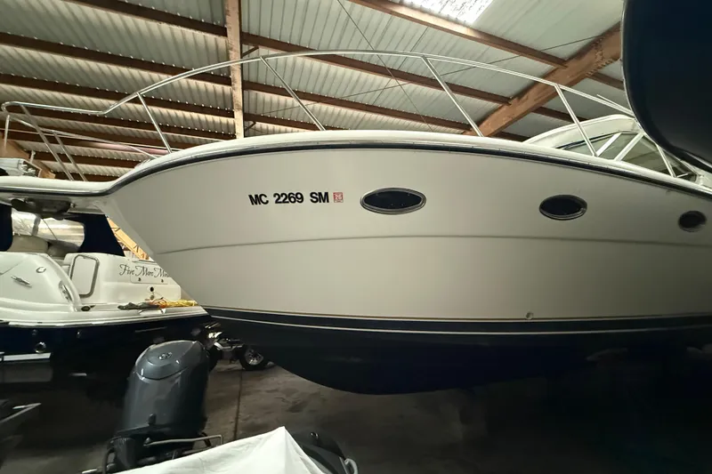 Slide: The Image of 1998 Tiara Yachts 3500 Open boat in indoor storage, side view. - 48
