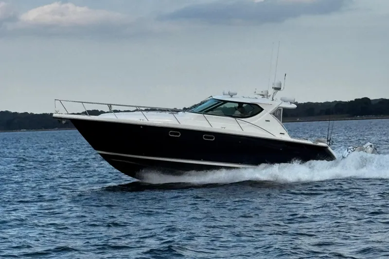 The Image of 2006 Tiara Yachts 4300 Sovran cruising on open water, side view. - 0