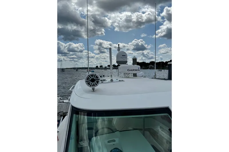 Slide: The Image of 2006 Tiara Yachts 4300 Sovran with Garmin equipment on a cloudy day. - 14