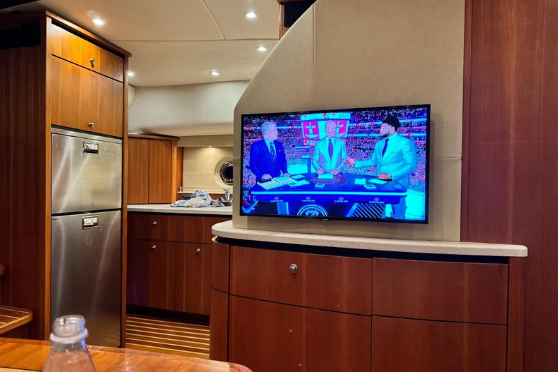 Slide: The Image of Interior of 2006 Tiara Yachts 4300 Sovran with TV and modern kitchen amenities. - 18