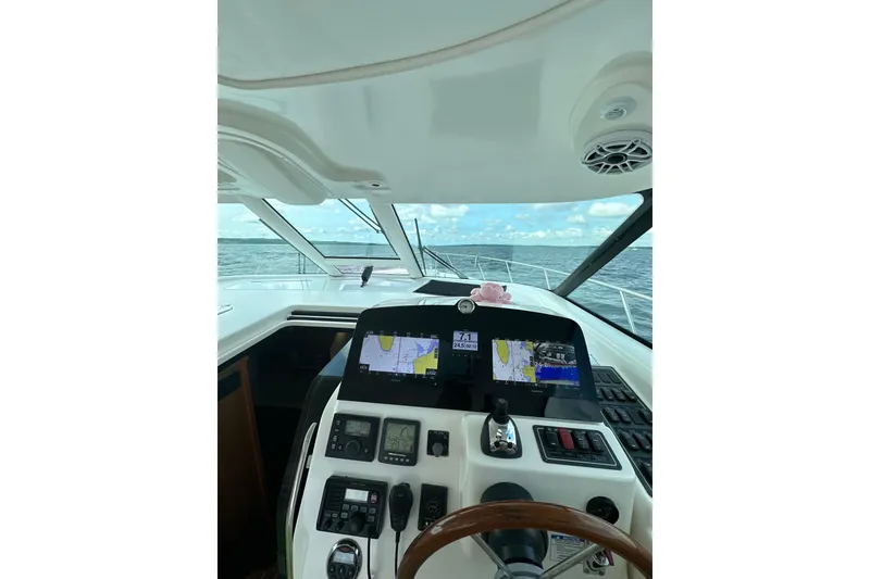 Slide: The Image of Helm of 2006 Tiara Yachts 4300 Sovran with navigation screens and ocean view. - 20