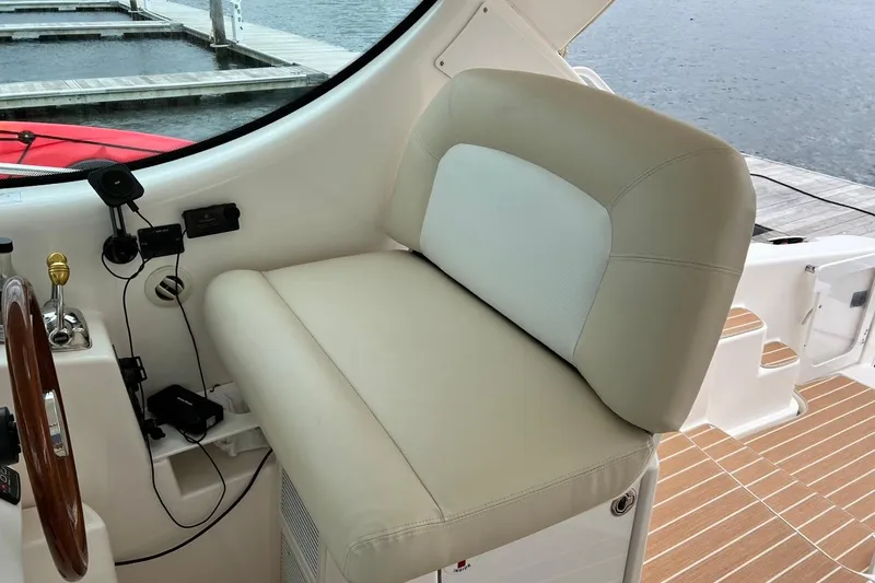 Slide: The Image of Helm seat of 2006 Tiara Yachts 4300 Sovran with steering wheel and controls. - 21