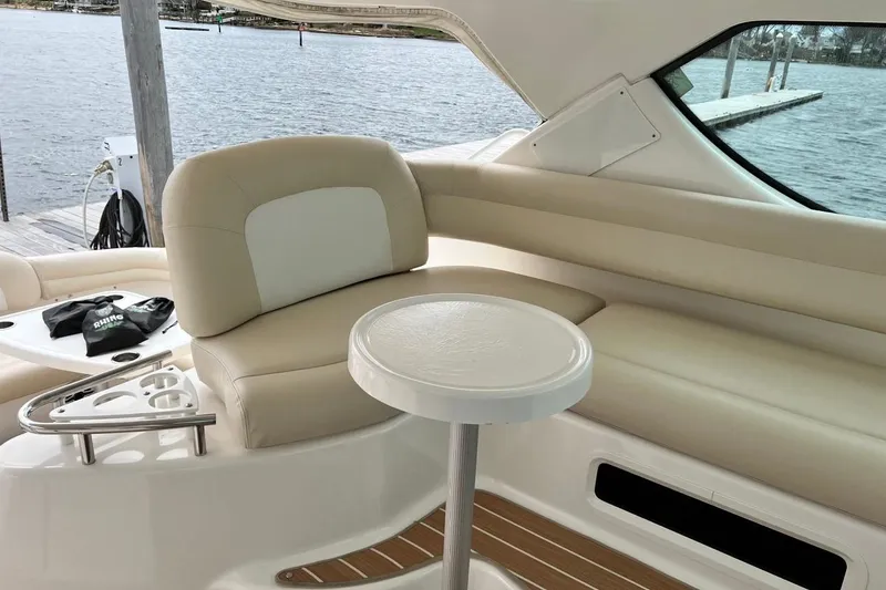 Slide: The Image of Luxurious interior of 2006 Tiara Yachts 4300 Sovran with beige seating and table. - 22