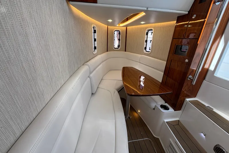 Slide: The Image of Luxurious interior of 2022 HCB 42 Lujo yacht with elegant seating and wooden table. - 12