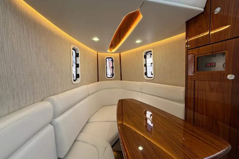 Slide: The Image of Luxurious interior of 2022 HCB 42 Lujo boat with elegant seating and wood finishes. - 13