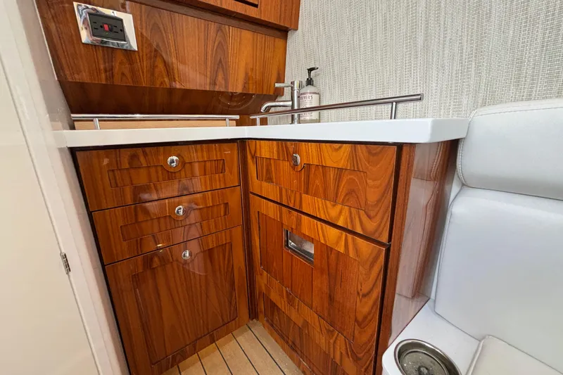 Slide: The Image of Luxurious wooden cabinetry in 2022 HCB 42 Lujo boat interior with modern sink and fixtures. - 14