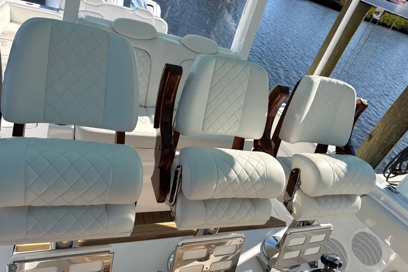 Slide: The Image of Luxurious seating on 2022 HCB 42 Lujo boat with quilted white upholstery. - 7