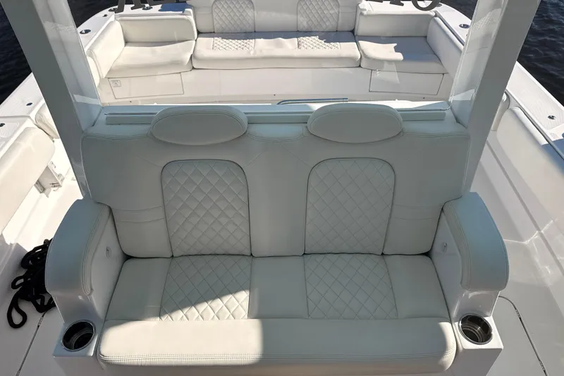 Slide: The Image of Luxurious seating on 2022 HCB 42 Lujo boat with quilted white upholstery. - 8