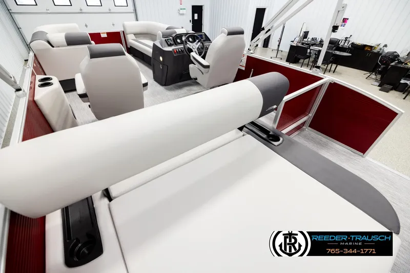 Slide: The Image of 2026 Bennington SSBSF pontoon boat interior with modern seating and steering console. - 11