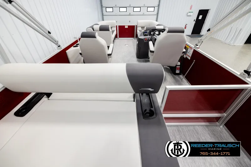 Slide: The Image of 2026 Bennington SSBSF pontoon boat interior with modern seating and steering console. - 16