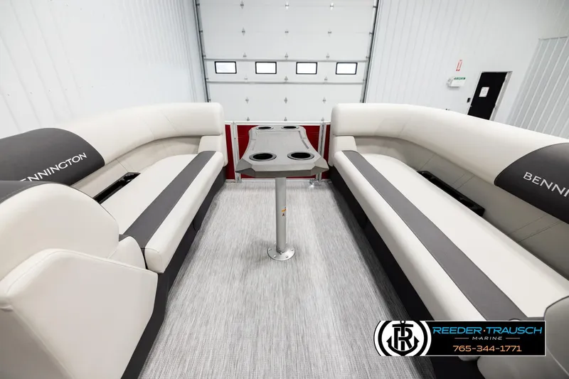 Slide: The Image of 2026 Bennington SSBSF boat interior with plush seating and central table. - 19