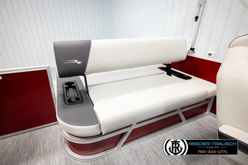 Slide: The Image of 2026 Bennington SSBSF boat seat with cup holders, red and white interior design. - 24