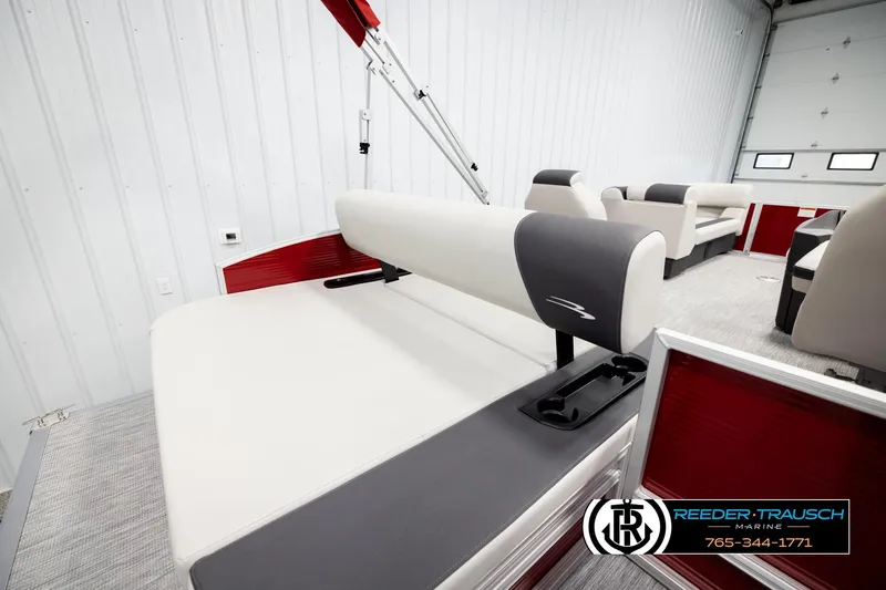Slide: The Image of 2026 Bennington SSBSF pontoon boat interior with red accents and comfortable seating. - 25
