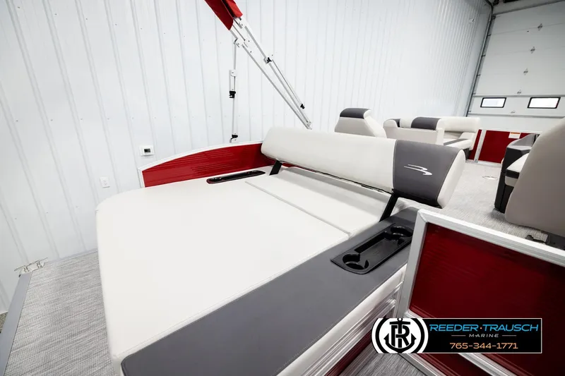 Slide: The Image of 2026 Bennington SSBSF boat interior with red accents and comfortable seating. - 26