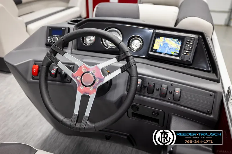 Slide: The Image of 2026 Bennington SSBSF boat dashboard with steering wheel and navigation display. - 32