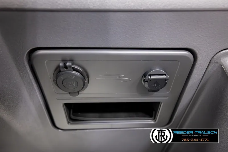 Slide: The Image of 12V power outlet on 2026 Bennington SSBSF boat dashboard. - 41