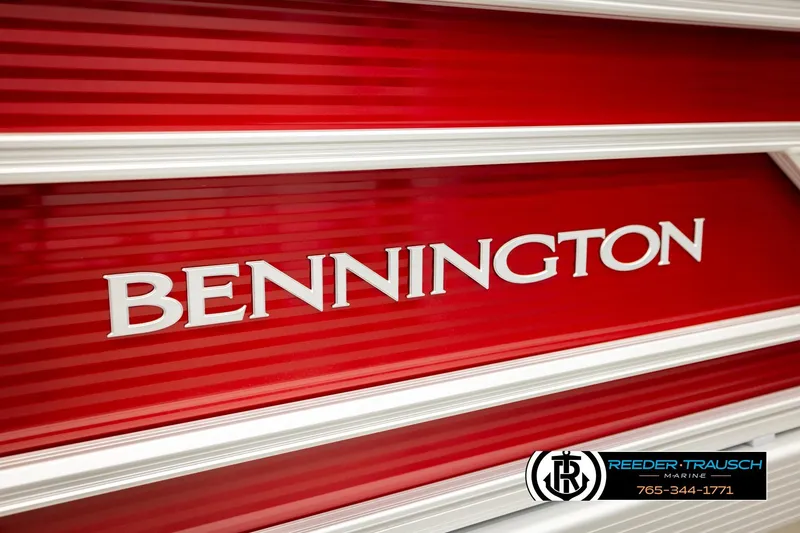 Slide: The Image of 2026 Bennington SSBSF boat logo on vibrant red background, Reeder-Trausch Marine branding. - 48