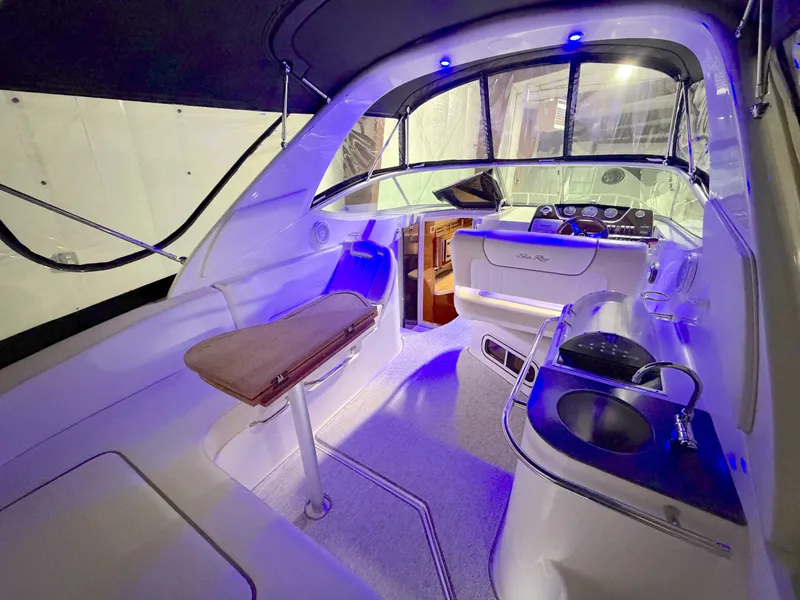 Slide: The Image of Interior of a 2012 Sea Ray Sundancer 280 yacht with blue lighting. - 5