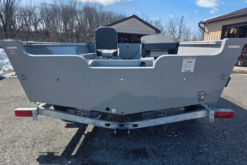 Slide: The Image of 2026 Smoker Craft Freedom 160 TL boat on trailer, parked outdoors. - 5