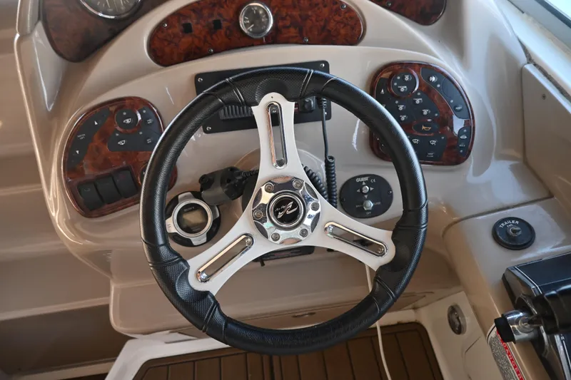 Slide: The Image of Steering wheel and dashboard of 2005 Sea Ray Sundancer 280 boat. - 12