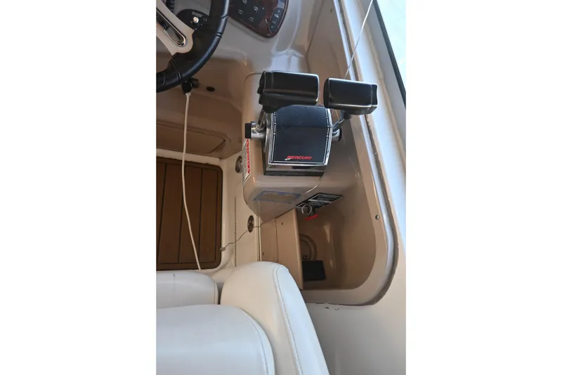 Slide: The Image of 2005 Sea Ray Sundancer 280 cockpit controls with Mercury throttle. - 14