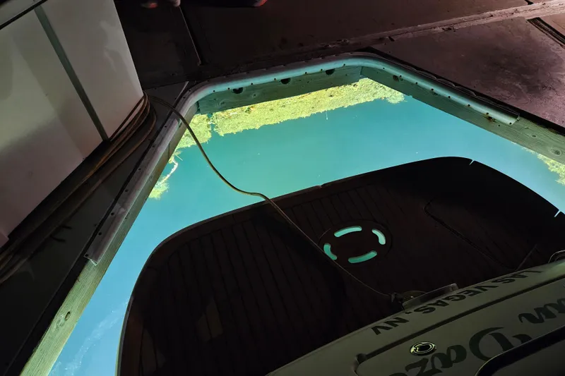 Slide: The Image of 2005 Sea Ray Sundancer 280 docked, view of water through open hatch. - 37