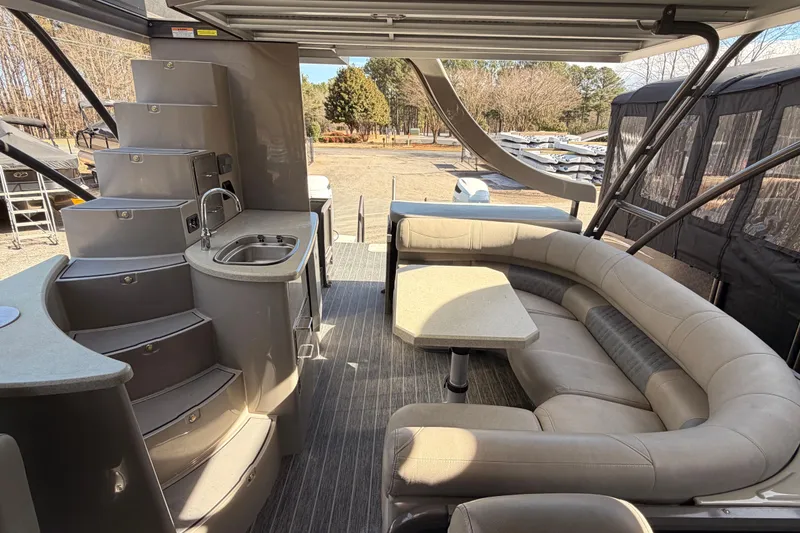 Slide: The Image of Luxurious 2022 Premier 350 Escalante boat interior with seating, kitchenette, and modern design. - 10