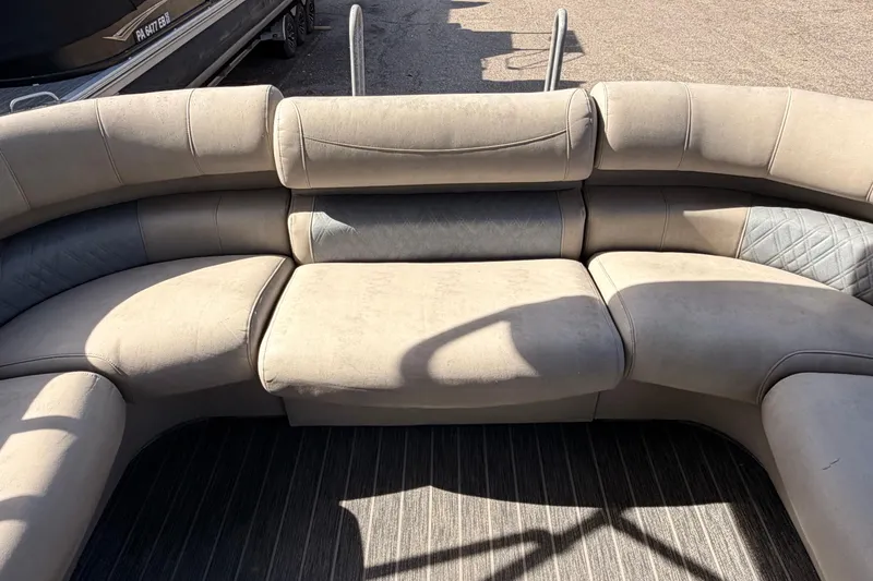Slide: The Image of Luxurious seating on 2022 Premier 350 Escalante pontoon boat, featuring plush, curved design. - 16